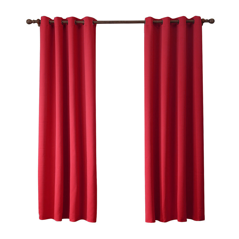 Détail du tissu Oxford rouge, montrant sa texture légèrement bombée et sa douceur modérée, parfait pour une décoration intérieure raffinée.